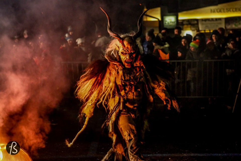 Please meet Krampus, Santa Claus’ shadow. Krampus is horrific beast that is half-demon and half-goat who, literally, beats children up from naughty to nice. Krampus isn’t exactly what you expect for Christmas, I assure you. Dark long fur, horns and fangs, this creature is St. Nicholas’ shadow and it comes with a chain and cow-bells that he whip about, along with a bunch of birch sticks meant to hit naughty children. It then kidnaps the bad kids and take them down to the underworld.