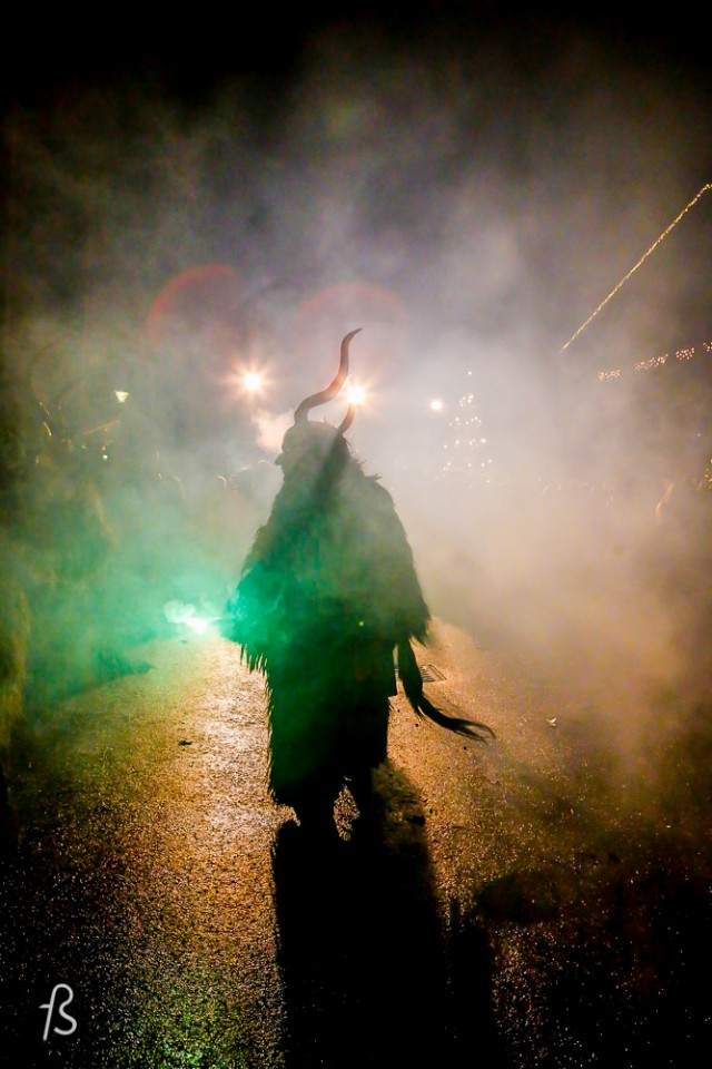 Please meet Krampus, Santa Claus’ shadow. Krampus is horrific beast that is half-demon and half-goat who, literally, beats children up from naughty to nice. Krampus isn’t exactly what you expect for Christmas, I assure you. Dark long fur, horns and fangs, this creature is St. Nicholas’ shadow and it comes with a chain and cow-bells that he whip about, along with a bunch of birch sticks meant to hit naughty children. It then kidnaps the bad kids and take them down to the underworld.