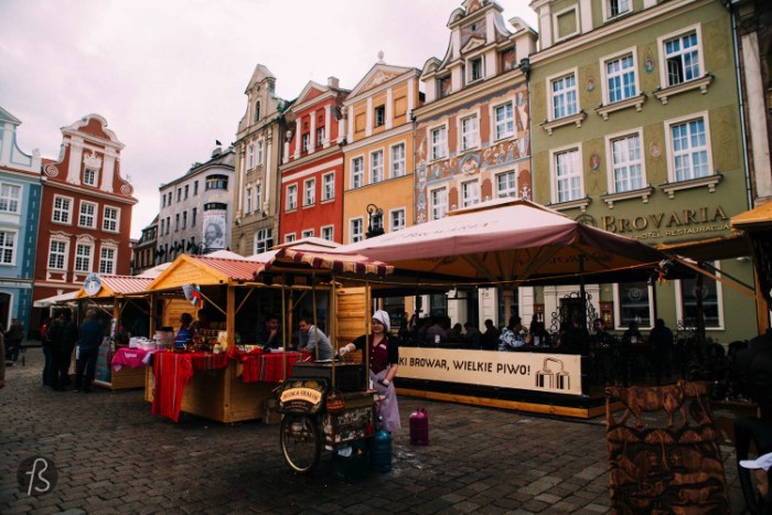 It’s in the center of the city that you’ll find one of our favorite historical places to visit in Poznan and this place is the Old Market Square — known in Polish as Stary Rinek. On this square, you’ll find the old Town Hall surrounded on every side but rows of merchant houses that, today, are a mix of restaurants and breweries.