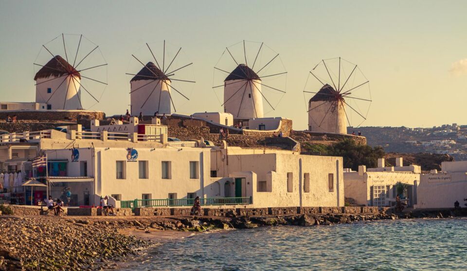 The windmills of Mykonos are one of the most iconic features of this beautiful island in the Aegean sea. From almost anywhere in the village of Mykonos, you can spot the windmills, and it's one of the first things you saw when you arrived in the island harbour. And they look gorgeous, painted all white against the blue sky.