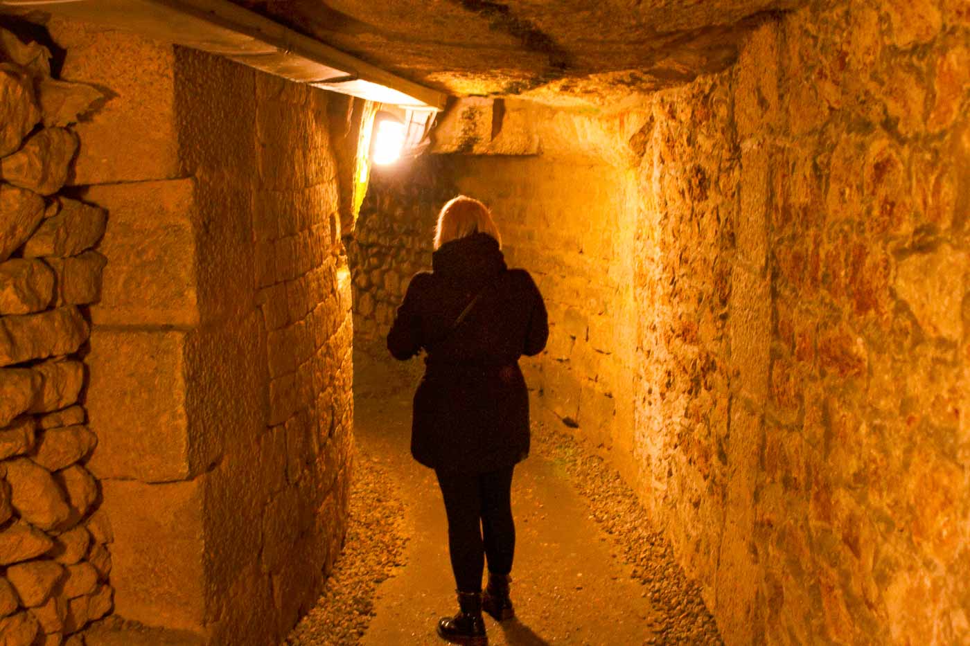 Under the romantic streets of Paris lies a world of darkness filled with the skeletal remains of millions of people. The Paris Catacombs hold a strange appeal, drawing those fascinated by the macabre and off-the-beaten-path history. 