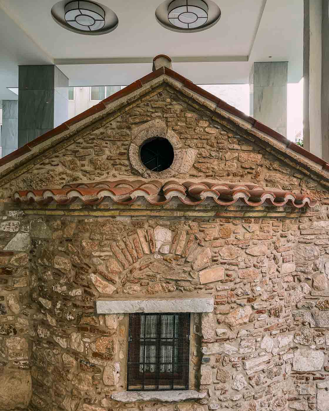 The Agia Dynamis Church is a small 16th-century hidden gem tucked away amidst modern buildings. I passed by it once, and it felt like a surreal movie set since the entire church is surrounded by a contemporary building, as you can see in the pictures here. 