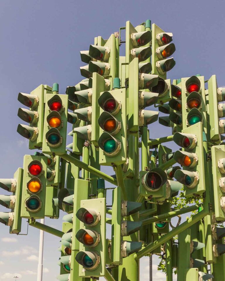 If you're looking for a unique and slightly puzzling attraction in London's Canary Wharf, look at the Traffic Light Tree. This eight-meter-tall sculpture, resembling a tree with 75 sets of traffic lights, is a sight to behold. It would be photogenic at night when its lights create a dazzling and colorful display.