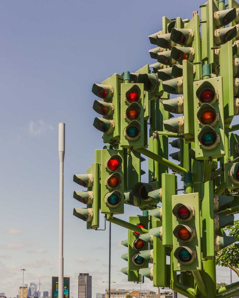 If you're looking for a unique and slightly puzzling attraction in London's Canary Wharf, look at the Traffic Light Tree. This eight-meter-tall sculpture, resembling a tree with 75 sets of traffic lights, is a sight to behold. It would be photogenic at night when its lights create a dazzling and colorful display.