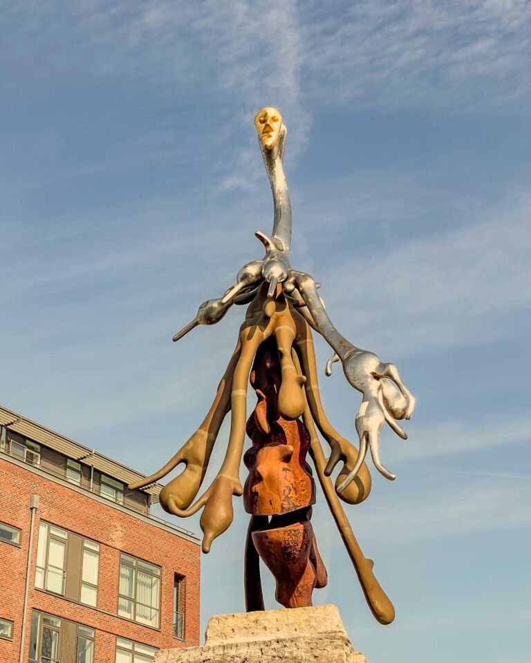 The Genetically Modified Little Mermaid is a thought-provoking sculpture by Bjørn Nørgaard. It’s definitely not your typical Little Mermaid; the sculpture is just one figure in a larger sculpture group called “The Genetically Modified Paradise” that can be found in a square called Dahlerups Pakhus.