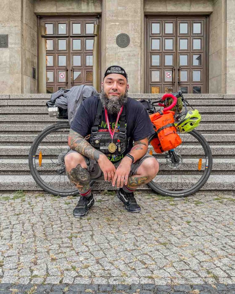 I talked to my girlfriend before and asked her to help me take my last picture with my bike next to Rathaus Neukölln just to mark my way home. And, before she took the photo, she gave me a medal!