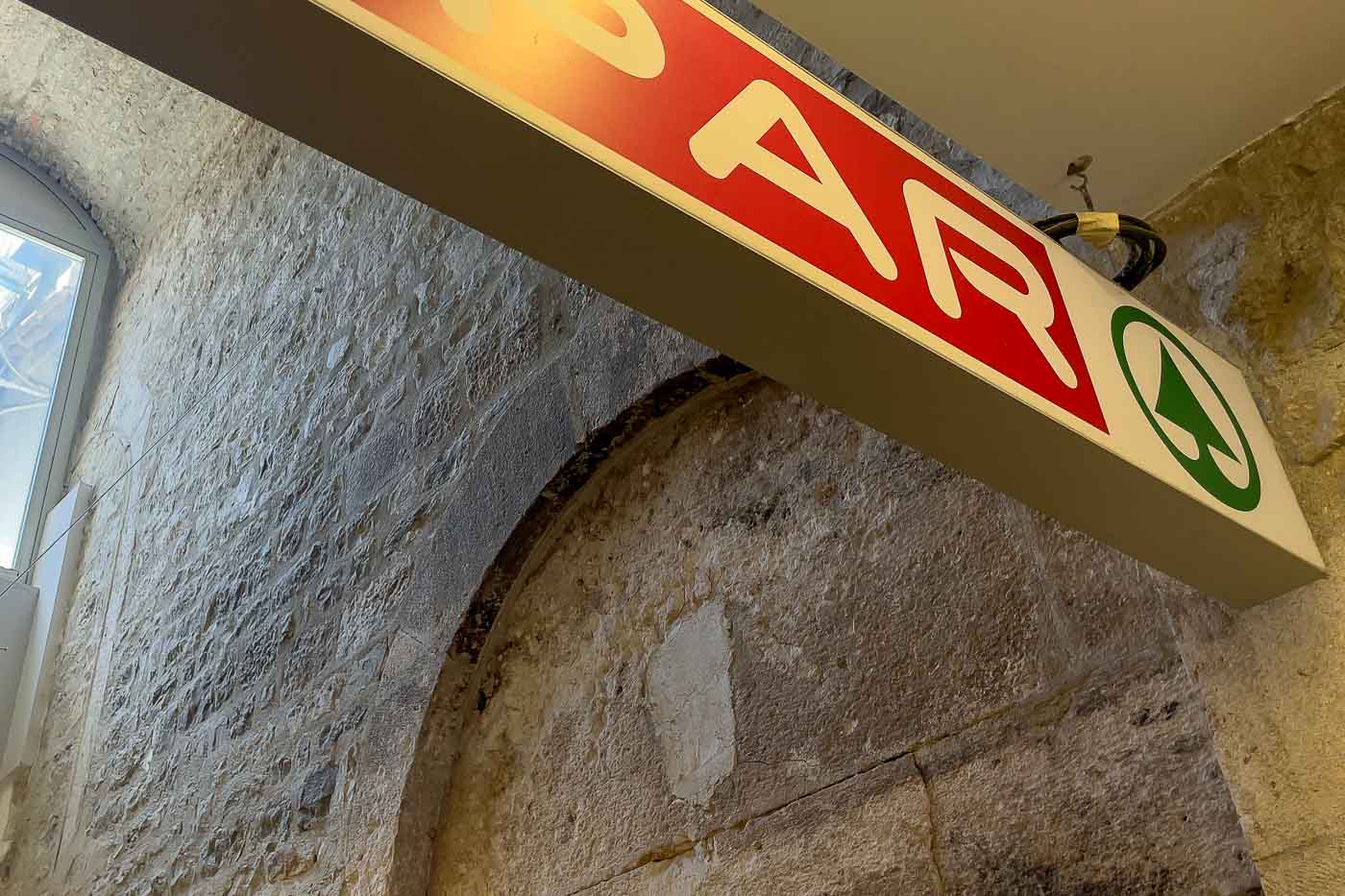 Split is a city where ancient Roman emperors once walked. Glowing white stone creates a labyrinthine old town, and unexpectedly, you can pick up your daily groceries in a building technically under UNESCO protection. Welcome to the curious case of the Unesco-protected Supermarket in Split, a SPAR grocery store that offers a shopping experience quite unlike any other in the world.