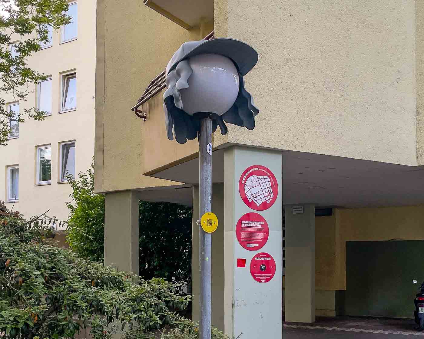 On the border of Mitte and Wedding lies Brunnenviertel, a neighborhood renowned for its inviting green spaces and tranquil, pedestrian-friendly courtyards. As dusk settles, a soft, romantic glow emanates from the area's distinctive spherical streetlamps. But there's a clever twist to that. Look closely, and you'll discover that many of these lamps are wearing hats. These are the Nightcaps, a brilliant public art installation that is both functional and fantastical.