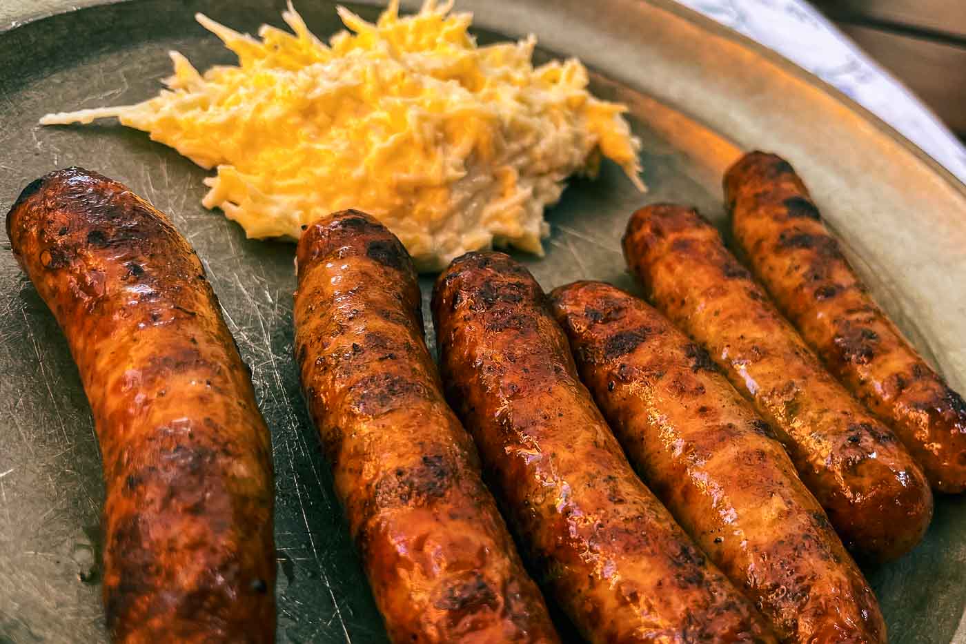 You can't have the best weekend in Nuremberg without trying the famous Nürnberger Rostbratwürstchen. Skip the chains and go straight to the source: Zum Gulden Stern. Operating since 1419, this is literally the oldest historic bratwurst kitchen in the world.