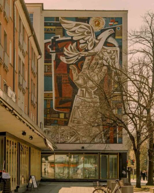 Even though the Eisenhüttenstadt murals are a bright feature of the city today, its roots go back to a time when borders changed and people came from Slavic countries. They were part of the final layer of this ideological construction. When you pass by a mosaic of a cosmonaut or a happy family on the side of a building, you are not enjoying pure art. They were placed there to help mend the wounds caused by the border changes, wars, and uprootings