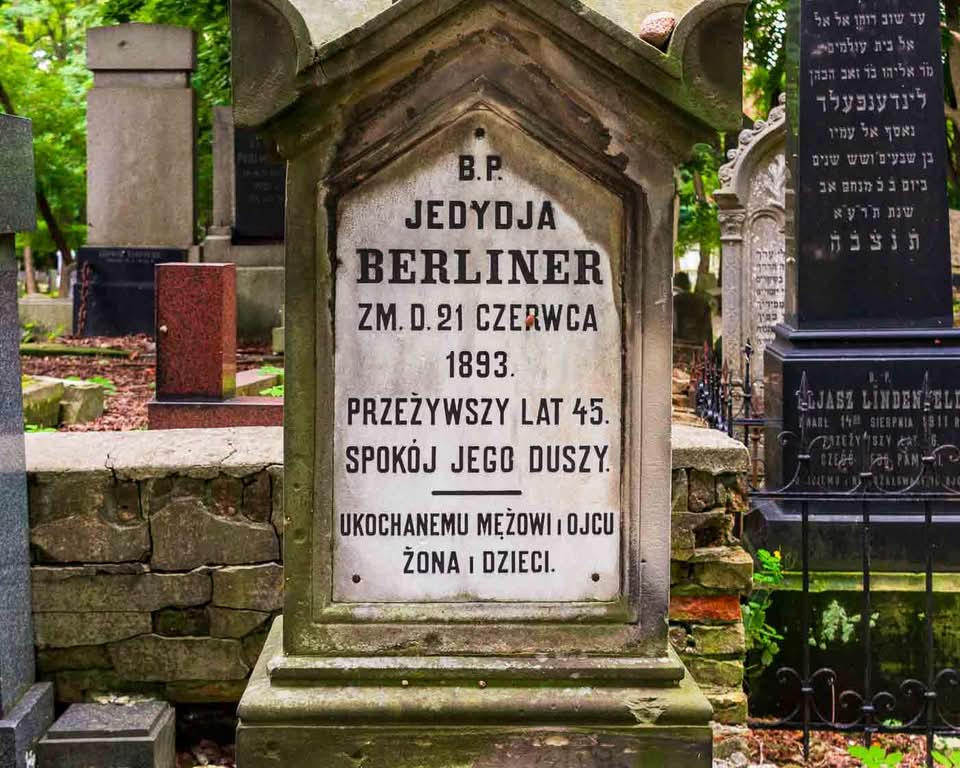 It is the Okopowa Street Jewish Cemetery. Spanning a bit over 33 hectares and containing upwards of 250,000 graves, it stands as the largest Jewish cemetery in Poland and one of the largest in Europe. There is a remarkable void in the landscape of the capital, where pre-war Warsaw is mainly unaltered and where moss, carved stone, and deep silence all serve as direct windows into the past.