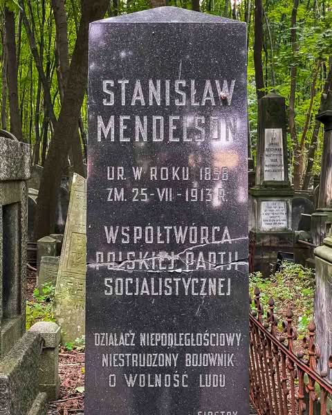 It is the Okopowa Street Jewish Cemetery. Spanning a bit over 33 hectares and containing upwards of 250,000 graves, it stands as the largest Jewish cemetery in Poland and one of the largest in Europe. There is a remarkable void in the landscape of the capital, where pre-war Warsaw is mainly unaltered and where moss, carved stone, and deep silence all serve as direct windows into the past.
